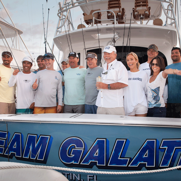 team galati on back of their fishing boat