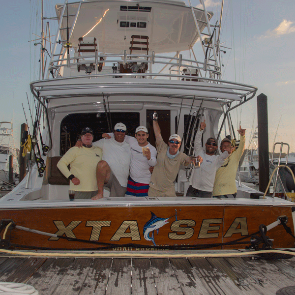 team xta sea on back of boat