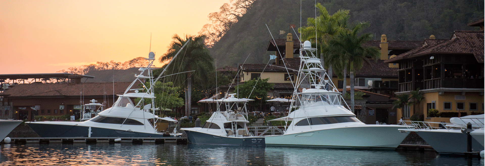 Boats at Los Sueños Marina during sunset